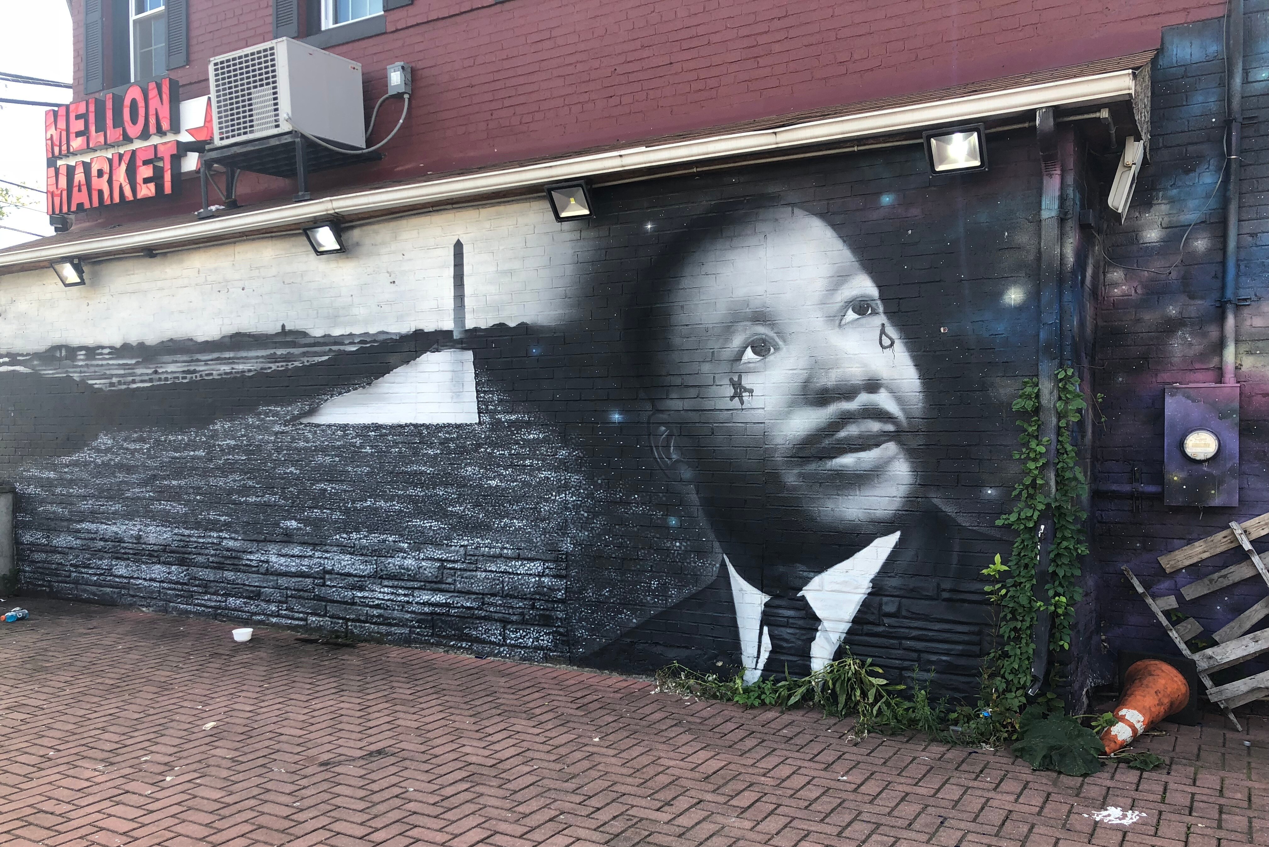 A mural of Martin Luther King, Jr. adorns the side of a market in the Anacostia neighborhood of Washington, D.C.
