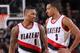 PORTLAND, OR - JANUARY 31: Damian Lillard #0 and C.J. McCollum #3 of the Portland Trail Blazers talks during the game against the Minnesota Timberwolves on January 31, 2016 at the Moda Center Arena in Portland, Oregon. NOTE TO USER: User expressly acknow
