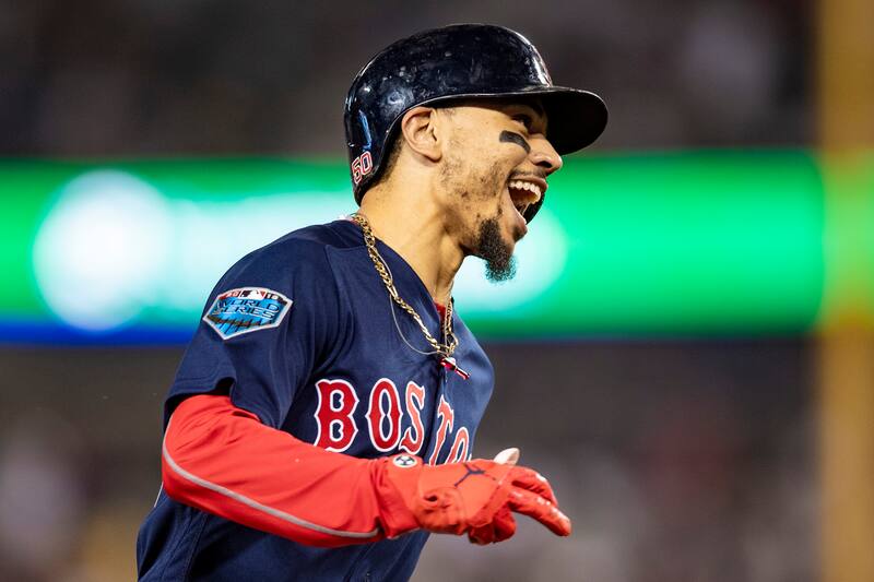 LOS ANGELES, CA - OCTOBER 28: Mookie Betts #50 of the Boston Red Sox reacts as he rounds the bases after hitting a solo home run during the sixth inning of game five of the 2018 World Series against the Los Angeles Dodgers on October 28, 2018 at Dodger St