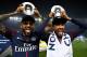 Paris Saint-Germain's Brazilian defender Dani Alves (L) and Paris Saint-Germain's Brazilian forward Neymar joke after winning the French L1 title at the end of the French L1 football match Paris Saint-Germain (PSG) vs Rennes on May 12, 2018 at the Parc de