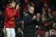 Manchester United's Portuguese manager Jose Mourinho (R) and Manchester United's Italian defender Matteo Darmian (L) applaud supporters on the pitch after the English Premier League football match between Manchester United and Liverpool at Old Trafford in