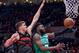 Jaylen Brown drives on Meyers Leonard.