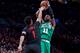 Kyrie Irving shooting on Evan Turner.