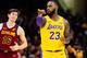 CLEVELAND, OH - NOVEMBER 21: Cedi Osman #16 of the Cleveland Cavaliers reacts as LeBron James #23 of the Los Angeles Lakers reacts after scoring to tie the game during the second half at Quicken Loans Arena on November 21, 2018 in Cleveland, Ohio. The Lak