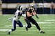 Taysom Hill plows into Rams safety LaMarcus Joyner.