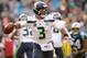 CHARLOTTE, NC - NOVEMBER 25: Russell Wilson #3 of the Seattle Seahawks rolls out against the Carolina Panthers during the first half of their game at Bank of America Stadium on November 25, 2018 in Charlotte, North Carolina. (Photo by Grant Halverson/Ge