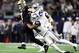 ARLINGTON, TEXAS - NOVEMBER 29: Taysom Hill #7 of the New Orleans Saints is tackled by Byron Jones #31 of the Dallas Cowboys at AT&T Stadium on November 29, 2018 in Arlington, Texas. (Photo by Ronald Martinez/Getty Images)