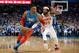 Russell Westbrook driving on DeAndre' Bembry.