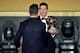 FC Barcelona and Argentina's forward Lionel Messi (R) holds his trophy as he shakes hands with Real Madrid and Portugal's forward Cristiano Ronaldo after receiving the 2015 FIFA Ballon dOr award for player of the year during the 2015 FIFA Ballon d'Or awa