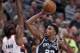 Rudy Gay shoots over Al-Farouq Aminu.