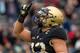WEST POINT, NY - NOVEMBER 17: Darnell Woolfolk #33 of the Army Black Knights gestures after scoring a touchdown against the Colgate Raiders at Michie Stadium on November 17, 2018 in West Point, New York. (Photo by Dustin Satloff/Getty Images)
