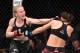 TORONTO, CANADA - DECEMBER 08: (L-R) Valentina Shevchenko of Kyrgyzstan punches Joanna Jedrzejczyk of Poland in their UFC strawweight championship fight during the UFC 231 event at Scotiabank Arena on December 8, 2018 in Toronto, Canada. (Photo by Josh H