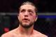 TORONTO, CANADA - DECEMBER 08: Brian Ortega reacts to his doctor stoppage loss to Max Holloway in their UFC featherweight championship fight during the UFC 231 event at Scotiabank Arena on December 8, 2018 in Toronto, Canada. (Photo by Josh Hedges/Zuffa
