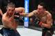 TORONTO, CANADA - DECEMBER 08: (R-L) Max Holloway punches Brian Ortega in their UFC featherweight championship fight during the UFC 231 event at Scotiabank Arena on December 8, 2018 in Toronto, Canada. (Photo by Josh Hedges/Zuffa LLC/Zuffa LLC via Getty