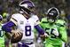 SEATTLE, WA - DECEMBER 10: Kirk Cousins #8 of the Minnesota Vikings looks to throw the ball as Frank Clark #55 of the Seattle Seahawks looks for the sack in the second quarter at CenturyLink Field on December 10, 2018 in Seattle, Washington. (Photo by Abb