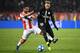 Red Star Belgrade's Dutch midfielder Lorenzo Ebicilio (L) vies with Paris Saint-Germain's Brazilian forward Neymar during the European Champions League football match Crvena Zvezda Belgrade vs Paris Saint-Germain (PSG) on December 11, 2018 at Rajko-Mitic