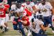 BOWLING GREEN, KY - OCTOBER 27: Napoleon Maxwell #23 of the Fiu Golden Panthers runs the ball as Ben Holt #44 of the Western Kentucky Hilltoppers makes the tackle from behind on October 27, 2018 in Bowling Green, Kentucky. (Photo by Michael Hickey/Getty I