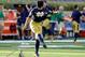 Justin Yoon works on his kicking technique before a game.