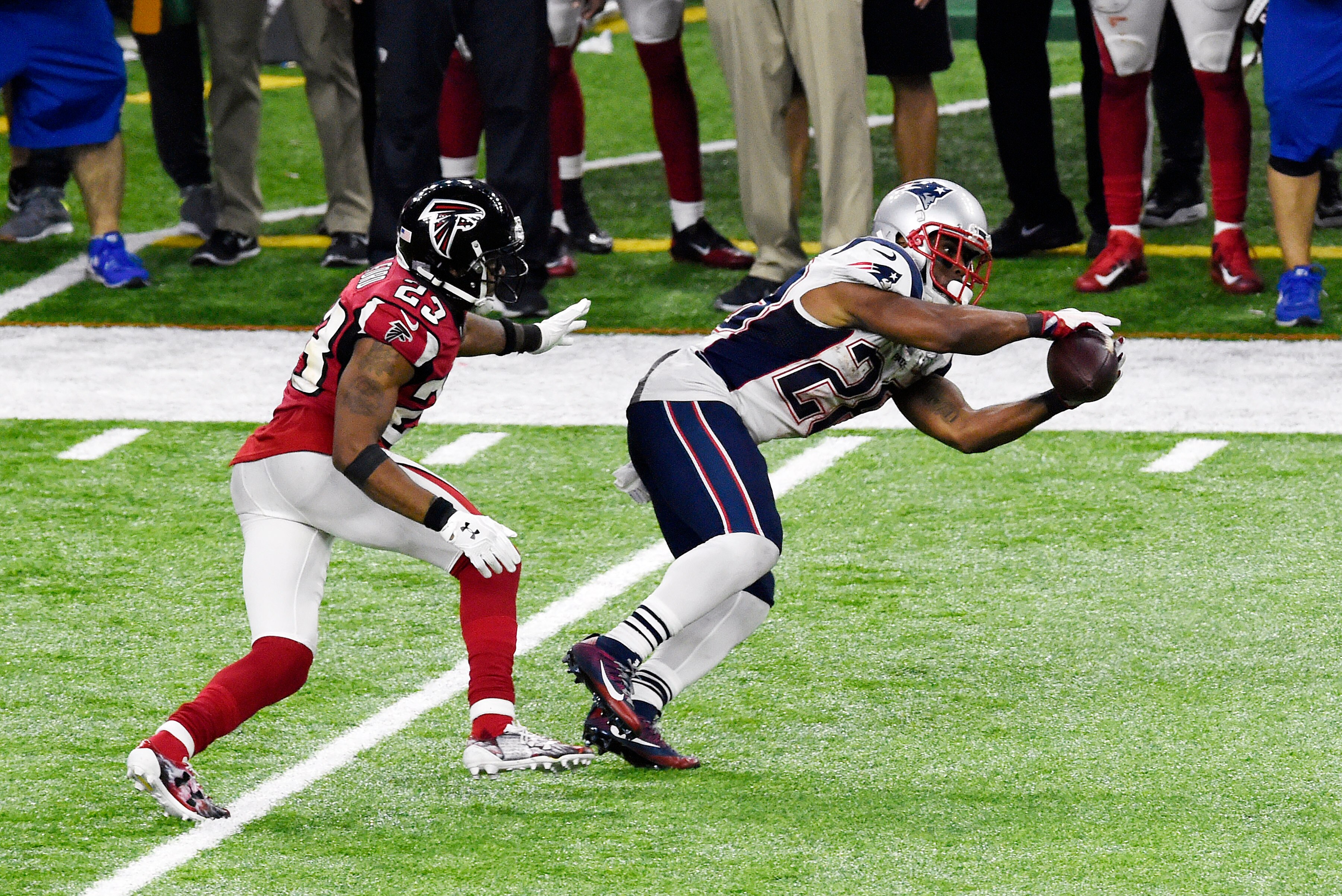 HOUSTON, TX - FEBRUARY 05: James White #28 of the New England Patriots catches a pass in front of Robert Alford #23 of the Atlanta Falcons during Super Bowl 51 at NRG Stadium on February 5, 2017 in Houston, Texas. The Patriots defeat the Atlanta Falcons 3