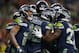 SEATTLE, WA - DECEMBER 23: Chris Carson #32 of the Seattle Seahawks celebrates his touchdown on a one yard rush with teammates Mike Davis #27 and Tyler Lockett #16 (L) during the fourth quarter of the game against the Kansas City Chiefs at CenturyLink Fi