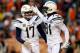 DENVER, COLORADO - DECEMBER 30: Quarterback Philip Rivers #17 and wide receiver Mike Williams #81 of the Los Angeles Chargers celebrate a touchdown against the Denver Broncos at Broncos Stadium at Mile High on December 30, 2018 in Denver, Colorado. (Photo
