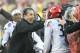 ANNAPOLIS, MARYLAND - DECEMBER 31: Head coach Luke Fickell of the Cincinnati Bearcats celebrates with James Wiggins #32 after Wiggins intercepted a Virginia Tech Hokies pass late in the fourth quarter during the Military Bowl at Navy-Marine Corps Memorial