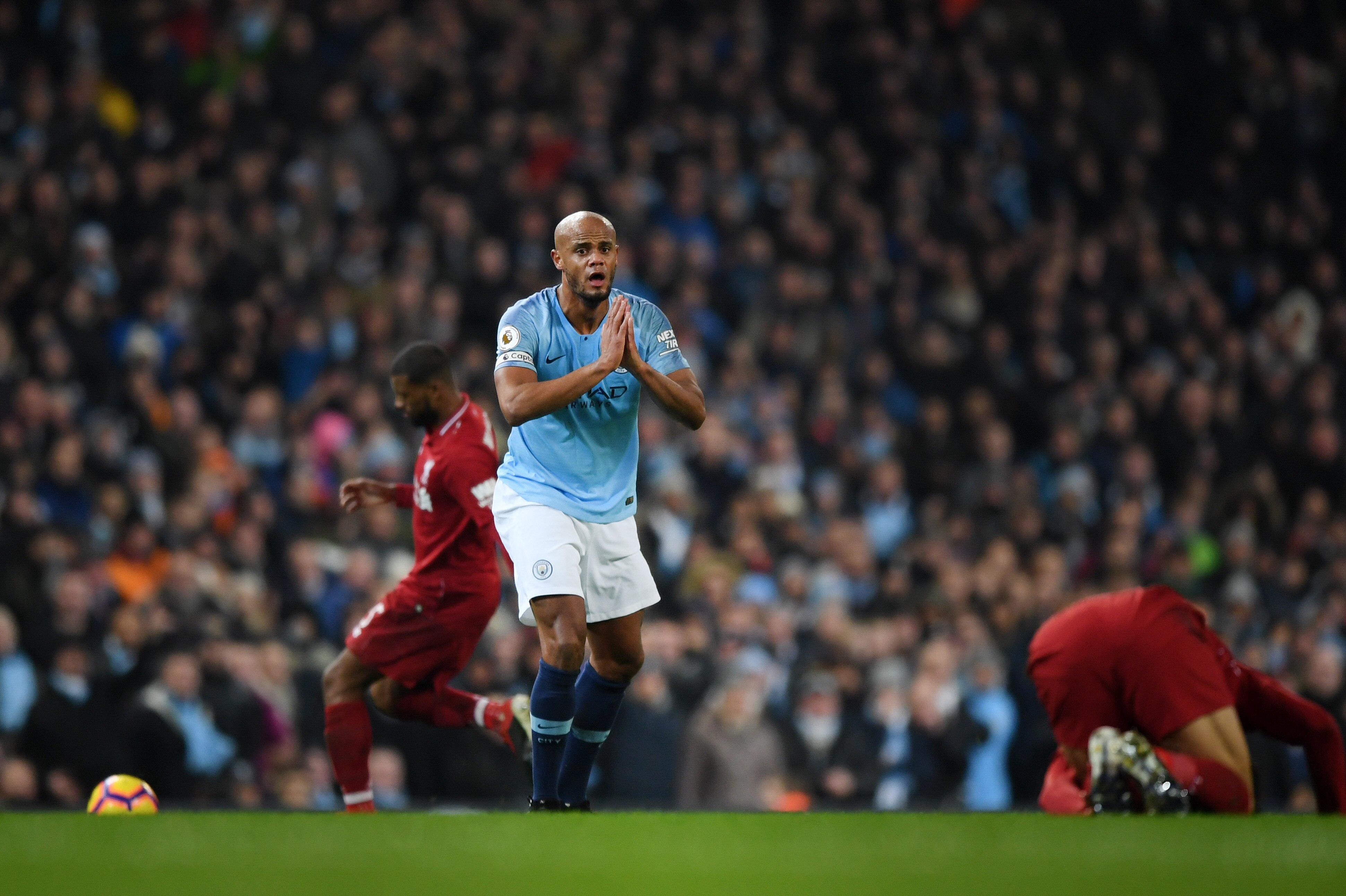MANCHESTER, ENGLAND - JANUARY 03: Vincent Kompany of Manchester City reacts during the Premier League match between Manchester City and Liverpool FC at the Etihad Stadium on January 3, 2019 in Manchester, United Kingdom. (Photo by Shaun Botterill/Getty I