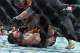LAS VEGAS, NV - JULY 07: Daniel Cormier (top) punches Stipe Miocic as referee Marc Goddard intervenes to stop their heavyweight championship fight at T-Mobile Arena on July 7, 2018 in Las Vegas, Nevada. Cormier won by first round knockout. (Photo by Sa