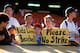 OAKLAND, CA - AUGUST 11: Fans hold up signs in protest of the baseball strike prior to the game between the Seattle Mariners and the Oakland Athletics at the Oakland Coliseum on August 11, 1994 in Oakland, California. (Photo by Brad Mangin/MLB Photos vi