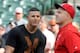 BALTIMORE, MD - MAY 15: Manny Machado #13 of the Baltimore Orioles talks with Mike Trout #27 of the Los Angeles Angels during batting practice before the game at Oriole Park at Camden Yards on May 15, 2015 in Baltimore, Maryland. (Photo by G Fiume/Getty