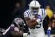 HOUSTON, TEXAS - JANUARY 05: Marlon Mack #25 of the Indianapolis Colts rushes past the tackle attempt of D.J. Reader #98 of the Houston Texans during the Wild Card Round at NRG Stadium on January 05, 2019 in Houston, Texas. (Photo by Bob Levey/Getty Image