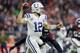 HOUSTON, TX - JANUARY 05: Andrew Luck #12 of the Indianapolis Colts looks to pass under pressure by Duke Ejiofor #53 of the Houston Texans in the third quarter during the Wild Card Round at NRG Stadium on January 5, 2019 in Houston, Texas. (Photo by Tim