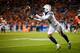 DENVER, CO - DECEMBER 30: Wide receiver Keenan Allen #13 of the Los Angeles Chargers reaches for a pass against the Denver Broncos in the fourth quarter of a game at Broncos Stadium at Mile High on December 30, 2018 in Denver, Colorado. (Photo by Justin