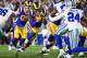 LOS ANGELES, CA - JANUARY 12: Running back Todd Gurley #30 of the Los Angeles Rams rushes for a short gain in the second quarter against the Dallas Cowboys in the NFC Divisional Round playoff game at Los Angeles Memorial Coliseum on January 12, 2019 in Lo