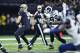 NEW ORLEANS, LA - NOVEMBER 4: Aaron Donald #99 of the Los Angeles Rams gets a hand on Drew Brees #9 of the New Orleans Saints at Mercedes-Benz Superdome on November 4, 2018 in New Orleans, Louisiana. The Saints defeated the Rams 45-35. (Photo by Wesley