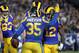 LOS ANGELES, CA - JANUARY 12: C.J. Anderson #35 of the Los Angeles Rams celebrates with teammates after a 1 yard touchdown run in the fourth quarter against the Dallas Cowboys in the NFC Divisional Playoff game at Los Angeles Memorial Coliseum on January