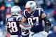 FOXBOROUGH, MASSACHUSETTS - JANUARY 13: James White #28 of the New England Patriots reacts with Rob Gronkowski #87 during the third quarter in the AFC Divisional Playoff Game against the Los Angeles Chargers at Gillette Stadium on January 13, 2019 in Foxb