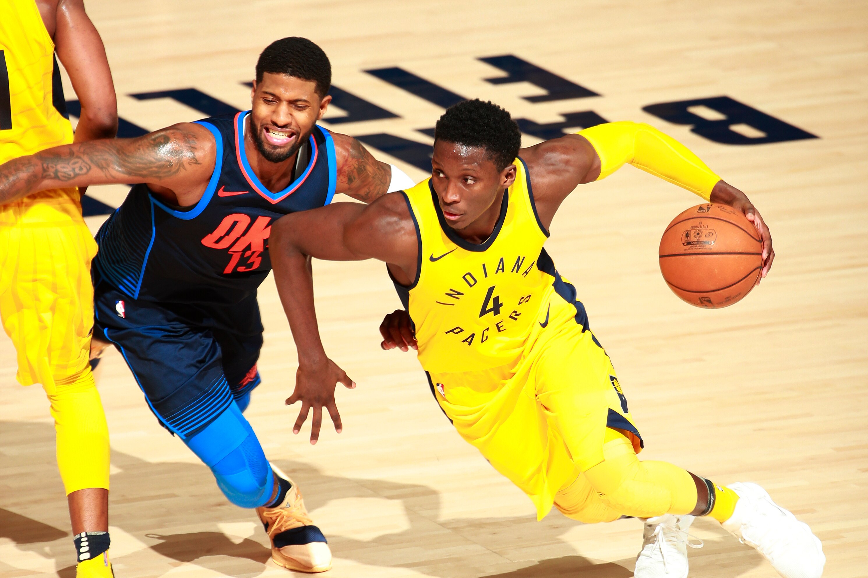 INDIANAPOLIS, IN - DECEMBER 13: Victor Oladipo #4 of the Indiana Pacers handles the ball against Paul George #13 of the Oklahoma City Thunder on December 13, 2017 at Bankers Life Fieldhouse in Indianapolis, Indiana. NOTE TO USER: User expressly acknowled