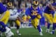 LOS ANGELES, CA - JANUARY 12: Los Angeles Rams running back C.J. Anderson #35 runs the ball against the Dallas Cowboys at Los Angeles Memorial Coliseum on January 12, 2019 in Los Angeles, California. (Photo by John McCoy/Getty Images)