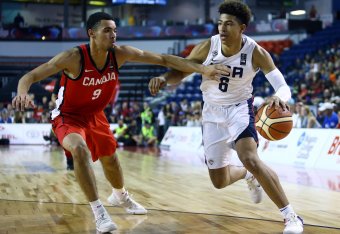 ST CATHARINES, ON - JUNE 16:  Quentin Grimes #6 of the United States dribbles the ball as Addison Patterson #9 of Canada defends during the Gold Medal final of the FIBA U18 Americas Championship at the Meridian Centre on June 16, 2018 in St. Catharines, C