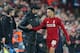 LIVERPOOL, ENGLAND - DECEMBER 11: Jurgen Klopp the manager of Liverpool shakes hands with Trent Alexander-Arnold after he was substituted during the UEFA Champions League Group C match between Liverpool and SSC Napoli at Anfield on December 11, 2018 in L