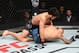 Cejudo (top) works to finish Dillashaw.