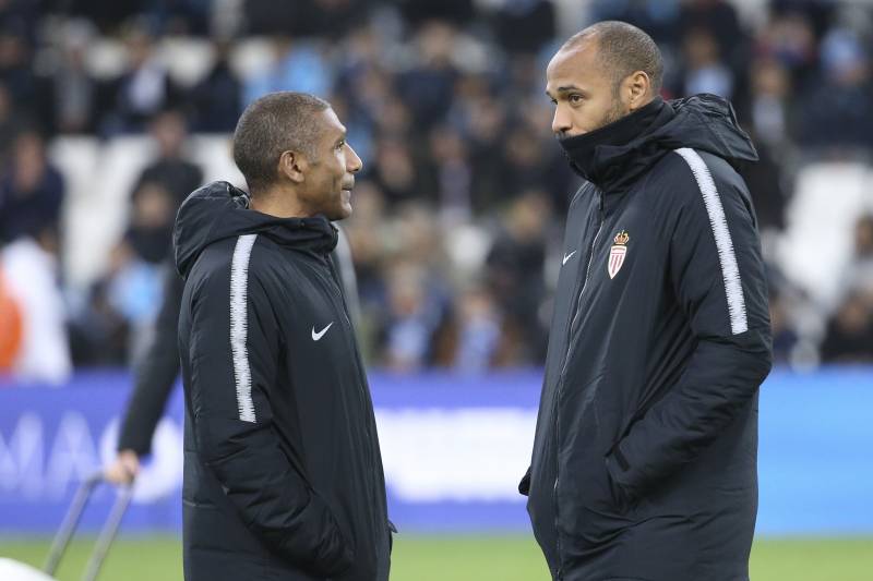 MARSEILLE, FRANCE - JANUARY 13: Coach of Monaco Thierry Henry and his assistant-coach Franck Passi (left) during the french Ligue 1 match between Olympique de Marseille (OM) and AS Monaco at Stade Velodrome on January 13, 2019 in Marseille, France. (Photo