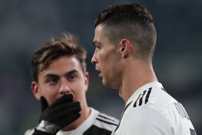 TURIN, ITALY - JANUARY 21:  Cristiano Ronaldo of Juventus speaks with his team-mate Paulo Dybala during the Serie A match between Juventus and Chievo at Allianz Stadium on January 21, 2019 in Turin, Italy.  (Photo by Emilio Andreoli/Getty Images)