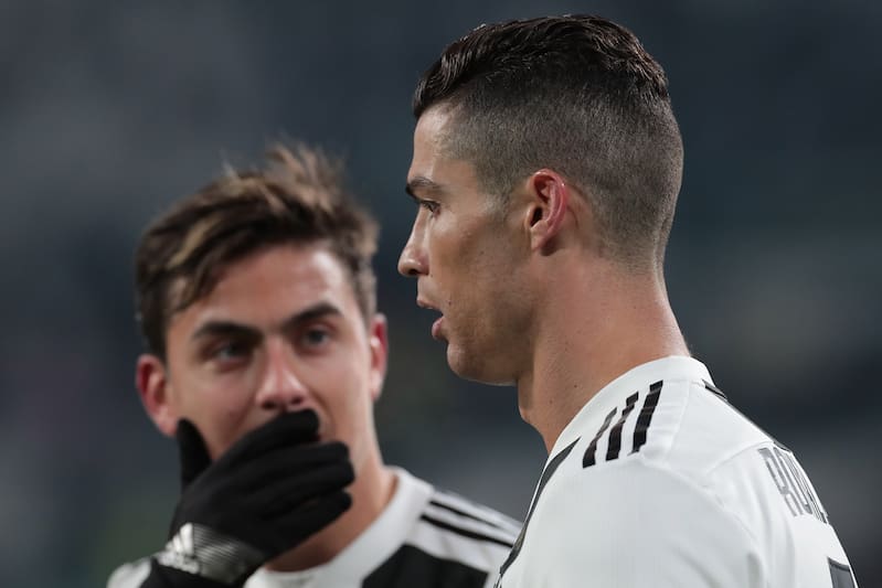 TURIN, ITALY - JANUARY 21: Cristiano Ronaldo of Juventus speaks with his team-mate Paulo Dybala during the Serie A match between Juventus and Chievo at Allianz Stadium on January 21, 2019 in Turin, Italy. (Photo by Emilio Andreoli/Getty Images)