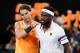 Spain's Rafael Nadal (L) embraces Frances Tiafoe of the US during their men's singles quarter-final match on day nine of the Australian Open tennis tournament in Melbourne on January 22, 2019. (Photo by DAVID GRAY / AFP) / -- IMAGE RESTRICTED TO EDITORIAL