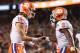 SANTA CLARA, CA - JANUARY 07: Trevor Lawrence #16 and Travis Etienne #9 of the Clemson Tigers celebrate their second quarter touchdown against the Alabama Crimson Tide in the CFP National Championship presented by AT&T at Levi's Stadium on January 7, 201