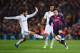 BARCELONA, SPAIN - MARCH 22: Lionel Messi of Barcelona takes on Isco (L) and Marcelo of Real Madrid CF (C) during the La Liga match between FC Barcelona and Real Madrid CF at Camp Nou on March 22, 2015 in Barcelona, Spain. (Photo by Alex Caparros/Getty