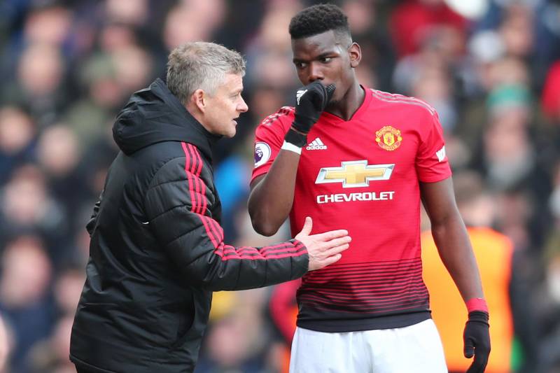 LONDON, ENGLAND - FEBRUARY 09:  Ole Gunnar Solskjaer, Interim Manager of Manchester United talks with Paul Pogba of Manchester United during the Premier League match between Fulham FC and Manchester United at Craven Cottage on February 9, 2019 in London, 