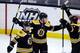 Torey Krug (front) set up the game-winning goal Saturday.